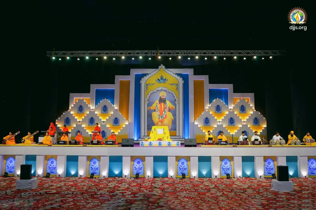 A tiered, lamp-lit stage for the monthly spiritual congregation at Divya Dham Ashram in January 2026