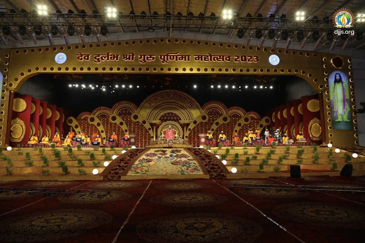 The golden, arched stage of Shri Guru Purnima Mahotsav 2023 at Nurmahal Ashram