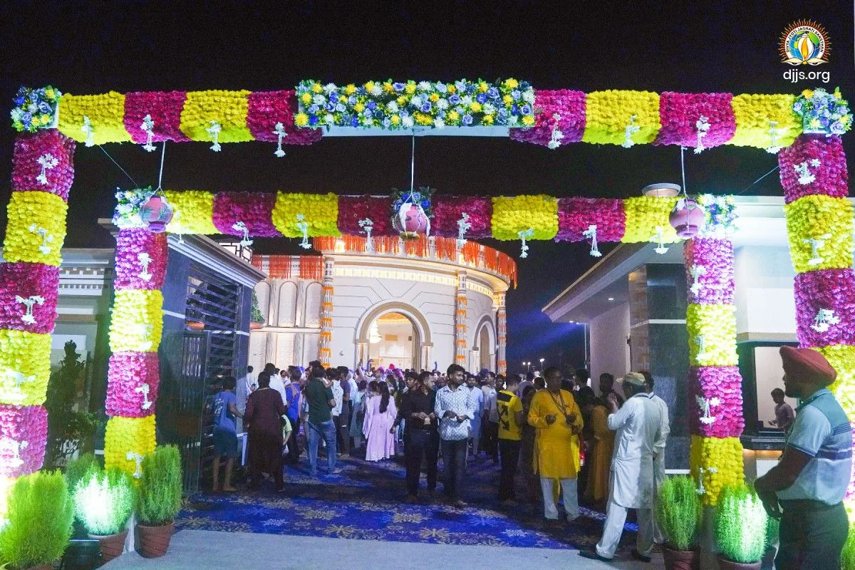 A gateway of white, yellow and pink flowers at Nurmahal Ashram for Janmashtami 2025